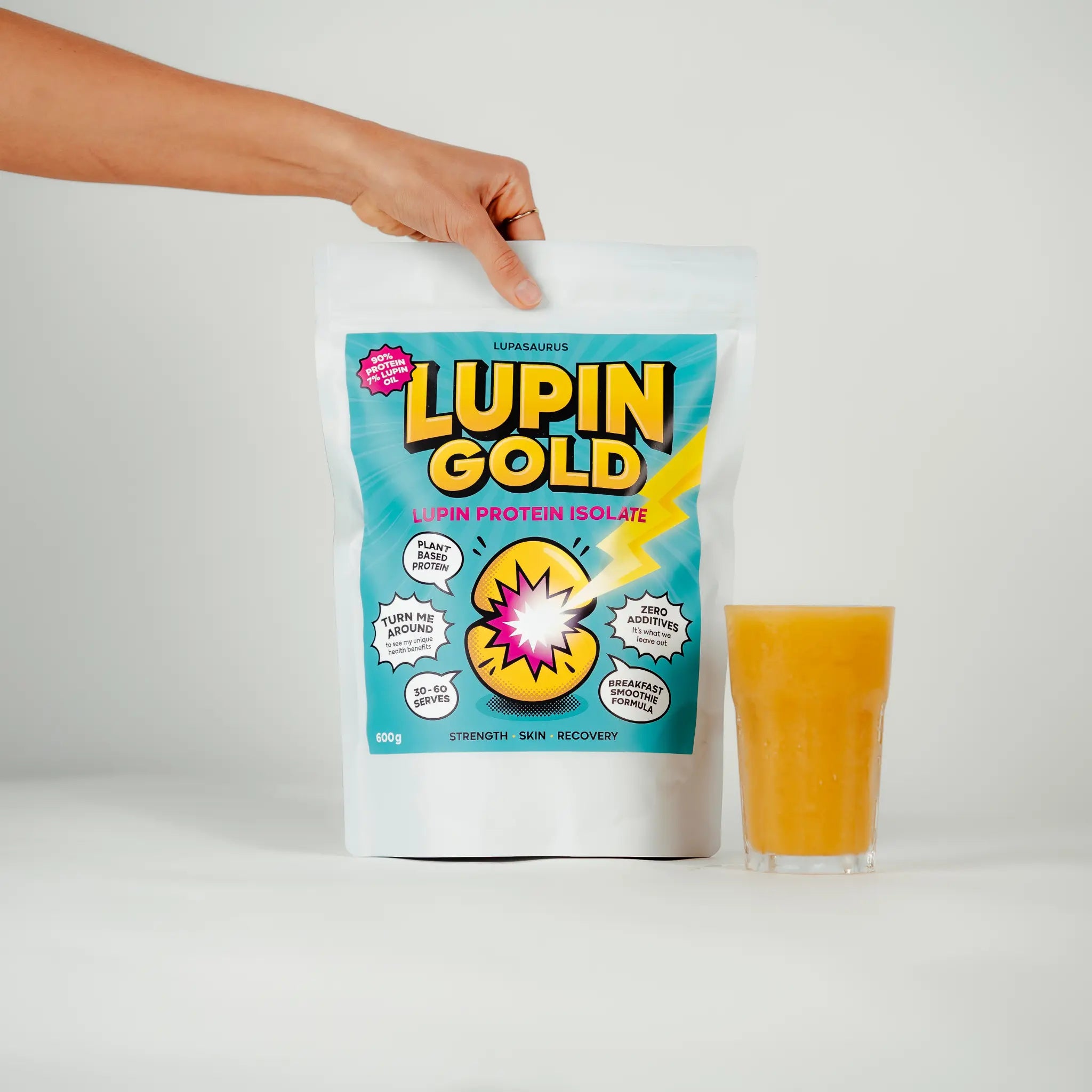 Lupin Gold protein isolate package with a glass of mango and lupin protein smoothie on a white background